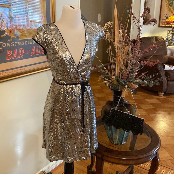 Aqua Dresses & Skirts - Aqua sequins wrap around dress NWT..